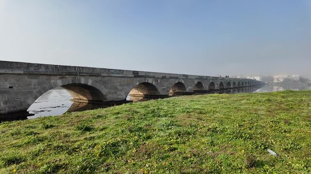 The Kanuni Sultan Suleyman Bridge, located in Silivri, Istanbul, Turkey, was built by Mimar Sinan in the 16th century. It is 333 meters long and has 32 arches.