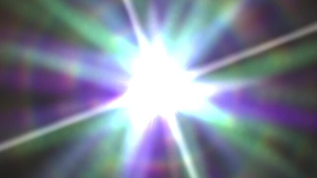 An intense and vibrant light burst emanates in multiple colors with shimmering rays and star-like effect against a dark background, creating a dynamic visual display.
