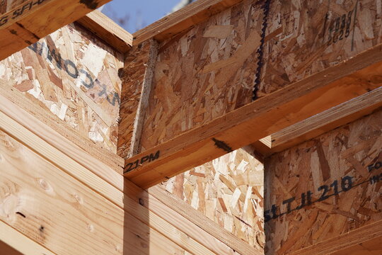 TJI roof joist with web stiffener at pitch point resting on top plate framing on construction site 