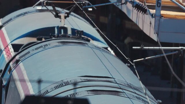 High-speed electric train pantograph moving under catenary