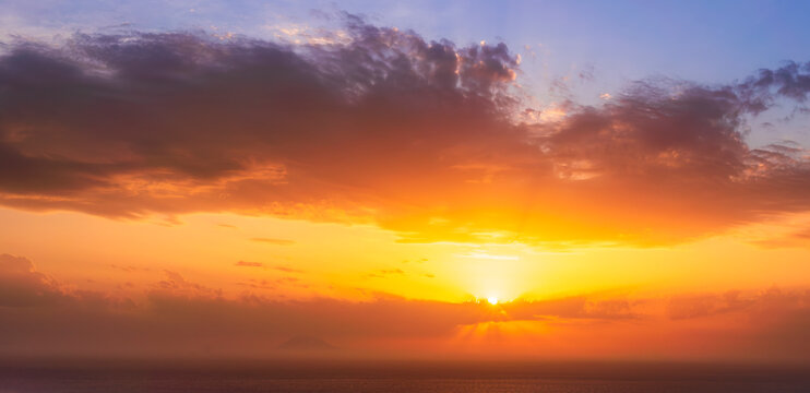 beautiful sunrise or sunset seascape with amazing calm sea water with waves and colorful amazing cloudy morning sky on background