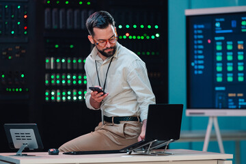 It engineer working in server room. Maintaining cybersecurity, network, and cloud technology...