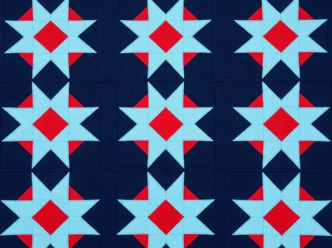 Quilt pattern with red and light blue star motifs on a dark blue background