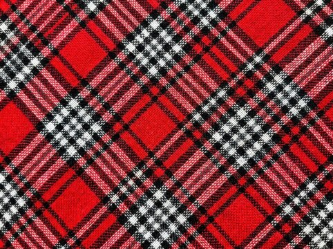Red and black tartan plaid fabric texture background