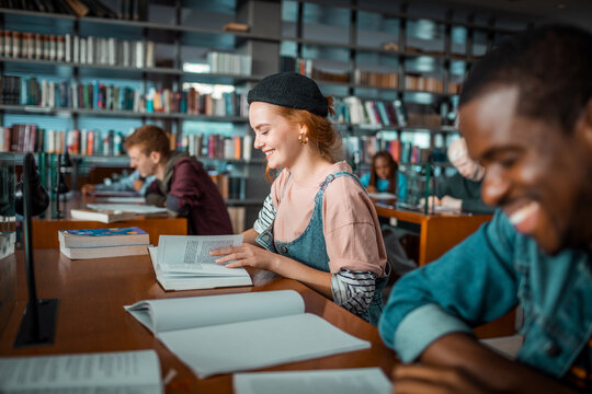 College students studying together in a library