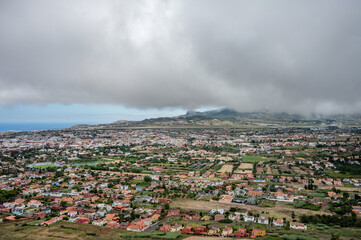 Obraz premium Airport and Coastal Landscape Covered by Dramatic Cloud Layer From Mountain Viewpoint