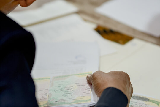 Islamic Marriage Contract Ceremony (Akad Nikah) - Religious Officiant Joining Hands with Groom During Ijab Qabul Ritual