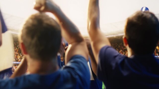 Passionate football fan shouts through megaphone in stadium, leading crowd during match for fan culture, stadium atmosphere and team support content.