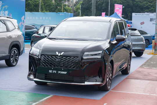 ZHONGSHAN GUANGDONG China-Aprill 11 2026: a glossy black Wuling Starlight 730 family MPV car.