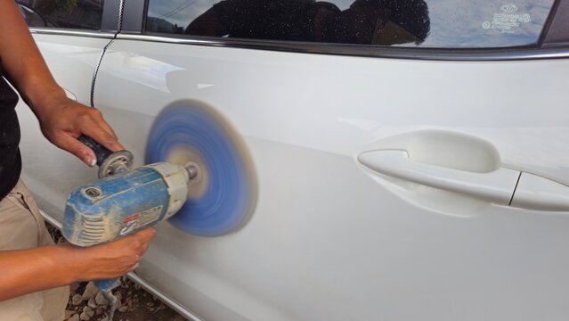 Car Body Polishing with Electric Buffer, Auto Detailing and Paint Restoration, Car body polishing with an electric buffer machine.
