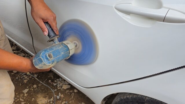 Car Body Polishing with Electric Buffer, Auto Detailing and Paint Restoration, Car body polishing with an electric buffer machine.