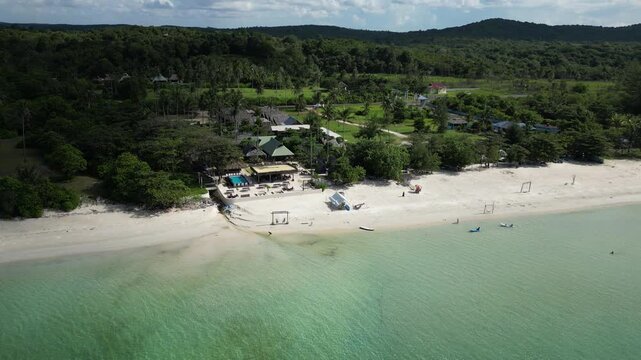 Aerial view of Trikora Beach Glamping featuring white sand beaches, turquoise waters, and lush tropical greenery in Kecamatan Gunung Kijang, Kepulauan Riau, Indonesia.