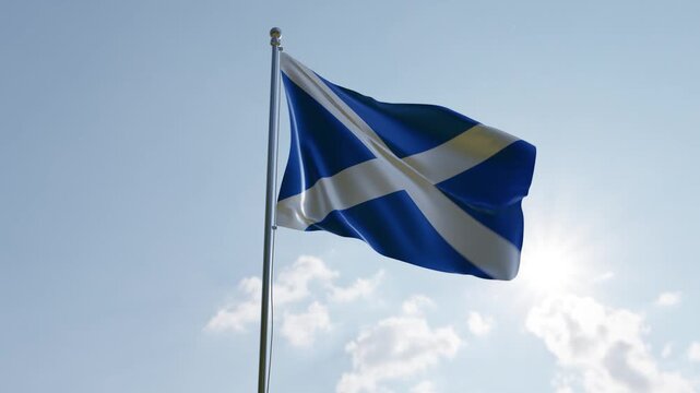 The Scottish Saltire Flag Waving Proudly Against a Bright Blue Sky with the Sun Shining
