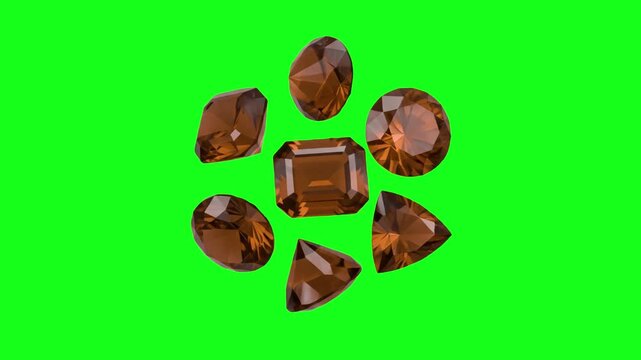 A group of precision-cut orange topaz crystals arranged in a circular formation as they rotate against a vibrant green screen background. This clip is prepped for easy compositing and chroma keying in