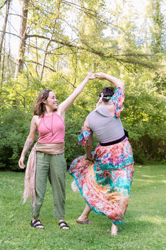 Women dancing in colorful fairy outfits