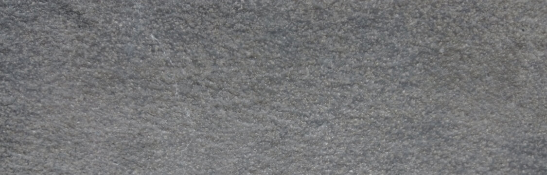 Dark grey slate texture background, natural charcoal stone surface with grain, rough mineral rock material for architectural design and backdrop