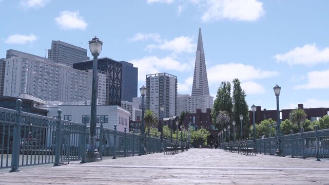 Pier Boardwalk With Iron Lamp Posts And Empty Benches In San Francisco - Steady Cam Shot