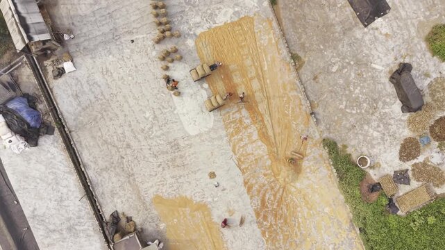 Circular aerial flight around a large rice processing complex, revealing the layout of the Khajanagar rice industry and surrounding facilities.