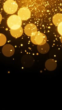 Golden bokeh lights shimmering at the top of a dark frame with copy space for text