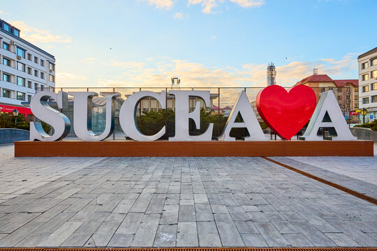 Suceava city sign with heart symbol in urban setting at sunset. March 3, 2026, Suceava Romania