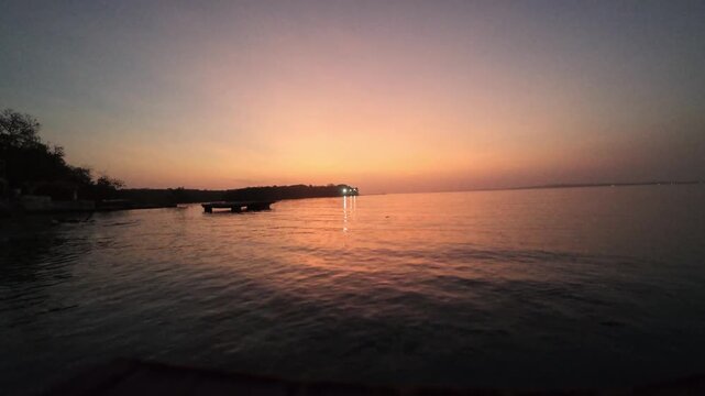 Serene lake sunset reflecting on calm water