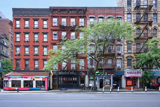 Manhattan, 3rd Avenue, facades of old apartment buildings with stores on ground floor