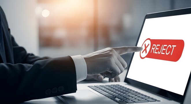 Business professional rejecting an offer on a laptop denial concept