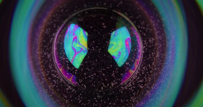 Psychedelic bubble. Oil pigment. Circle lens bokeh frame on sand night black background. Abstract floating gasoline neon ink blend fluid.