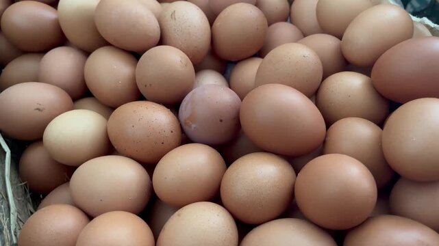 Close Up View of Fresh Brown Chicken Eggs Pile Texture