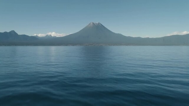 Scenic atitlan volcano view across calm lake waters