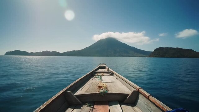 Stunning Atitlan volcano view from boat moving on blue lake water