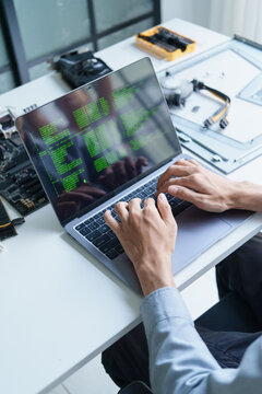 Asian programer using AI vibe coding on laptop