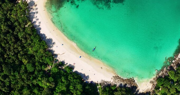 Aerial view Drone camera of seashore rocks in summer season, Beautiful freedom beach in Phuket Thailand, Amazing sea waves crashing on rocks seascape in Phuket island Thailand