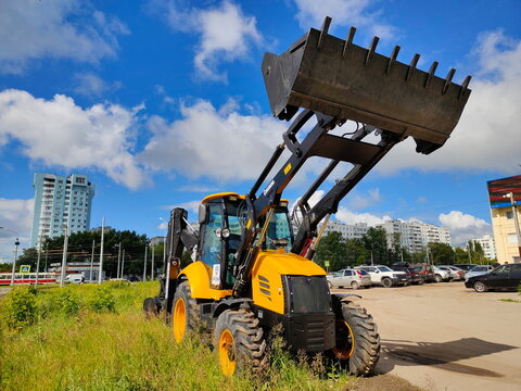 Russia, Samara. May 2, 2026: Turkish Cukurova 884 backhoe loader - road construction equipment. Text in Russian: Arslan Trading House, official dealer.