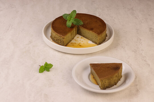 Matcha quesillo is a creamy caramel custard dessert infused with matcha green tea powder, combining the smooth texture of traditional quesillo with the earthy and slightly sweet flavor of matcha. 