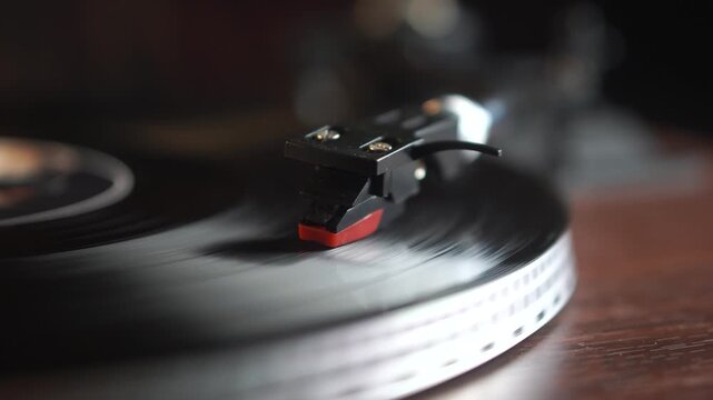 Starting Playback on Vinyl Record on Spinning Turntable, Close Up