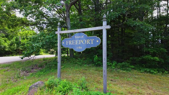 Freeport Maine 1789 town welcome sign on a leafy summer lane