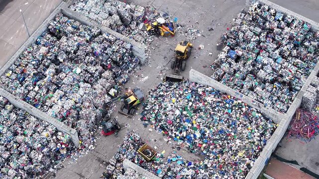 Plastic waste processing at a recycling facility with sorting activities