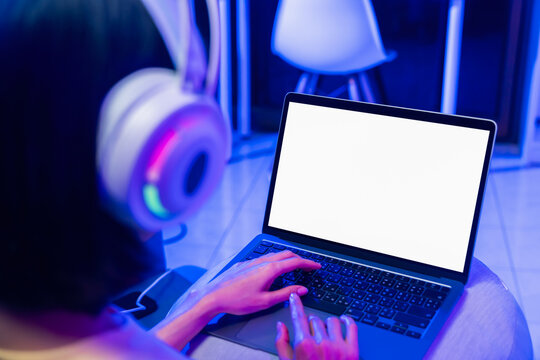 Hands using laptop with blank screen, computer mockup and digital technology concept.
