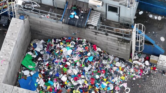Plastic waste processing at industrial recycling facility in operation