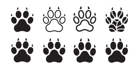Fototapeta premium Collection of various clawed animal paw prints in outline and solid styles for wild animal design work.