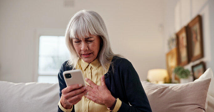 Stress, old woman and chest pain at house with phone, research and symptoms for heart attack. Discomfort, senior person and mobile app for cardiac emergency, urgent assistance and medical condition