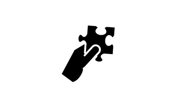 A black icon of a jigsaw puzzle piece being held by a hand suggesting problem solving contribution fit finding the right solution and missing piece