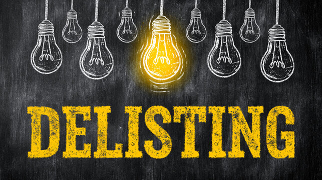 Delisting Lightbulb Idea: A glowing lightbulb illuminates the word DELISTING against a blackboard background, symbolizing a bright idea or concept related to the removal from a list.