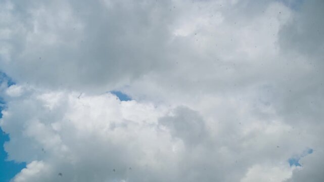 Timeless clouds move from a clear sky to a stormy sky. Timelapse Dynamic Sky Transition from Scattered Cumulus Clouds to Severe Dark Thunderstorm and Heavy Rainfall Over Landscape