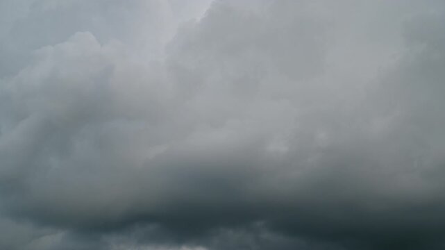 Timeless clouds move from a clear sky to a stormy sky. Timelapse Dynamic Sky Transition from Scattered Cumulus Clouds to Severe Dark Thunderstorm and Heavy Rainfall Over Landscape
