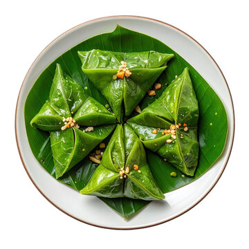 Miang kham: five leaf-wrapped bites on banana leaf overhead view isolated on white background