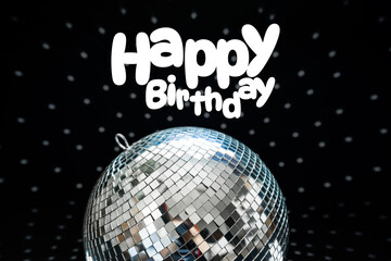 Fototapeta premium Happy birthday celebration with a disco ball and festive decorations in a dark setting