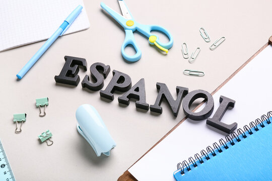 Office supplies with the word espanol on desk