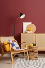 Fototapeten Restaurant Interior of living room with wooden commode, armchair and pumpkins  © Pixel-Shot